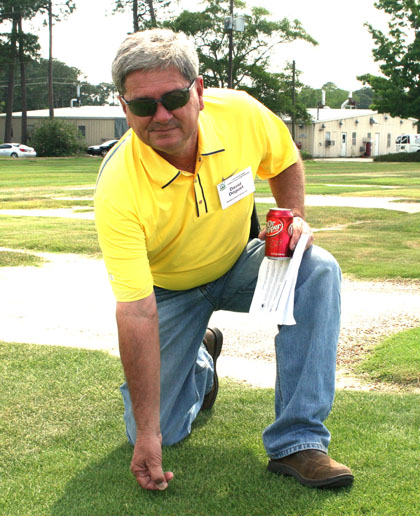 David Doguet, owner of Bladerunner Farms in Poteet, TX, poses with Zeon Zoysia Grass on the UGA Tifton campus.