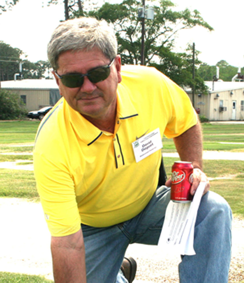 David Doguet, owner of Bladerunner Farms in Poteet, TX, poses with Zeon Zoysia Grass on the UGA Tifton campus.
