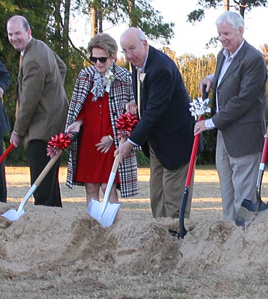 Jim and Barbara Andrews, center with red ribbons, helped to break ground on the Andrews Visitor and Education Center at the Coastal Georgia Botanical Gardens at the Historic Bamboo Farm in Savannah on Nov. 24, 2013. 
The center, which was funded with a gift from the Andrews, will serve as center of learning and social activity as the garden undergoes major renovations over the next several years.