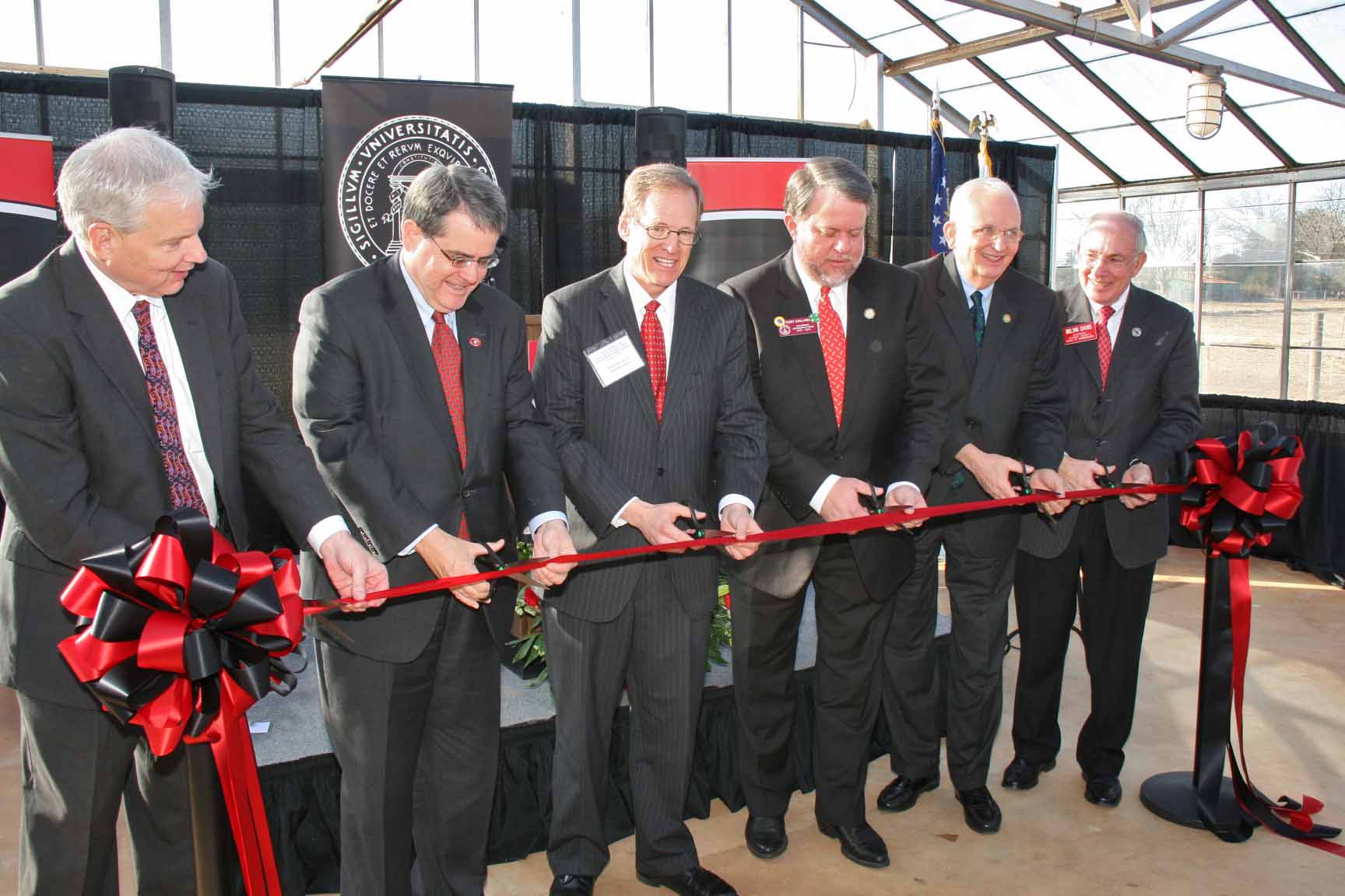 Dean J. Scott Angle, of the UGA College of Agricultural and Environmental Sciences; UGA President Jere Morehead, Rep. Jack Kingston, state Rep. Terry England, Georgia Commissioner of Agriculture Gary Black and Oconee County Commission Chairman Melvin Davis cut a ceremonial ribbon at UGA's J. Phil Campbell Sr. Research and Education Center Tuesday, Jan. 21.
