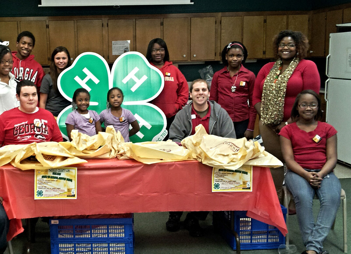 Joi Whitaker (standing, far right), a VISTA member serving in Thomas County, helped lead the MLK Day of Service School Supply Drive.