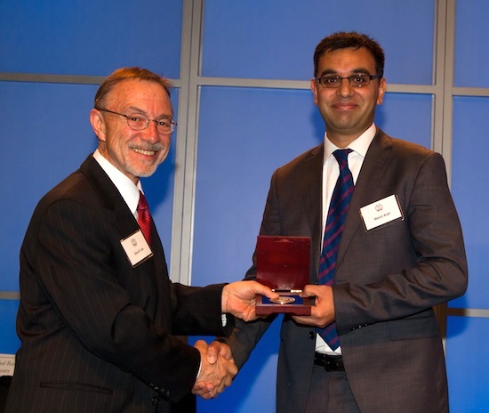 University of Georgia scientist Walid Alali was presented the university's 2014 Creative Research Medal based on his research on salmonella in the poultry industry. Alali is a food scientist with the University of Georgia College of Agricultural and Environmental Sciences. He is shown (right) receiving the honor from UGA Vice President for Research David Lee.