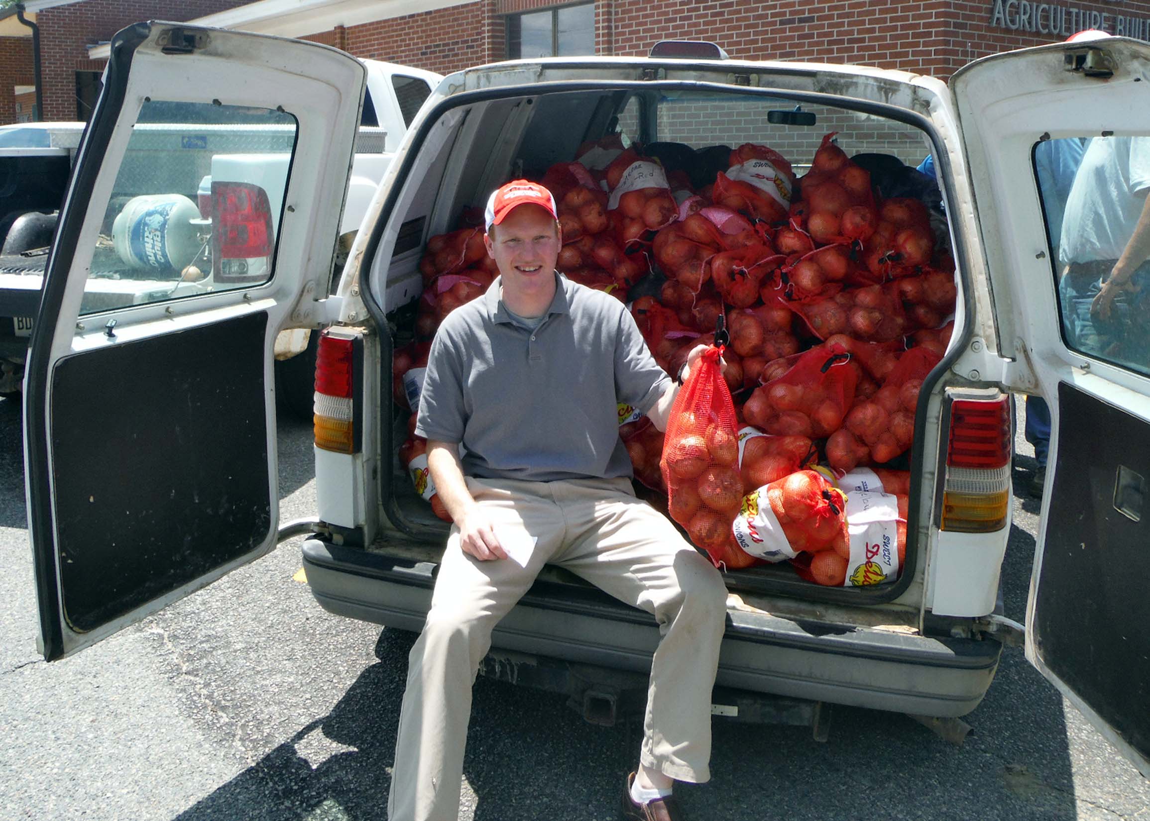 UGA Crop Quality Lab manager Daniel Jackson with a load of research samples from the Vidalia Onion Research Center.