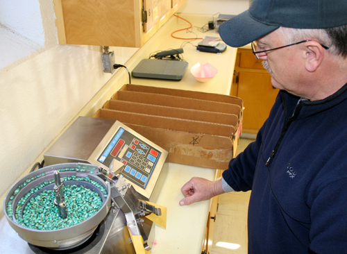 Gary Ware runs a seed counting machine in the UGA Variety Testing Program laboratory in Griffin, Ga.