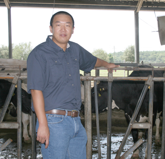 Sha Tao stands at the dairy on the UGA Tifton Campus.