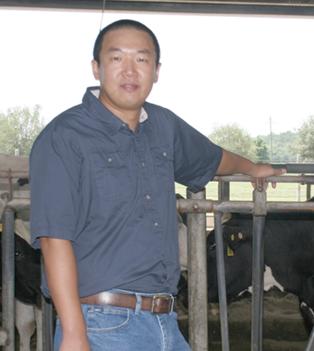 Sha Tao stands at the dairy on the UGA Tifton Campus.
