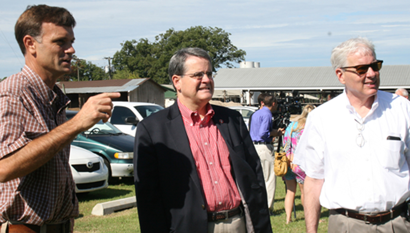 UGA President Jere Morehead, center, and Scott Angle, dean of the UGA College of Agricultural and Environmental Sciences, meet with Calvin Moody, co-owner of Brooksco Dairy in Quitman on Wednesday, Sept. 3, 2014.