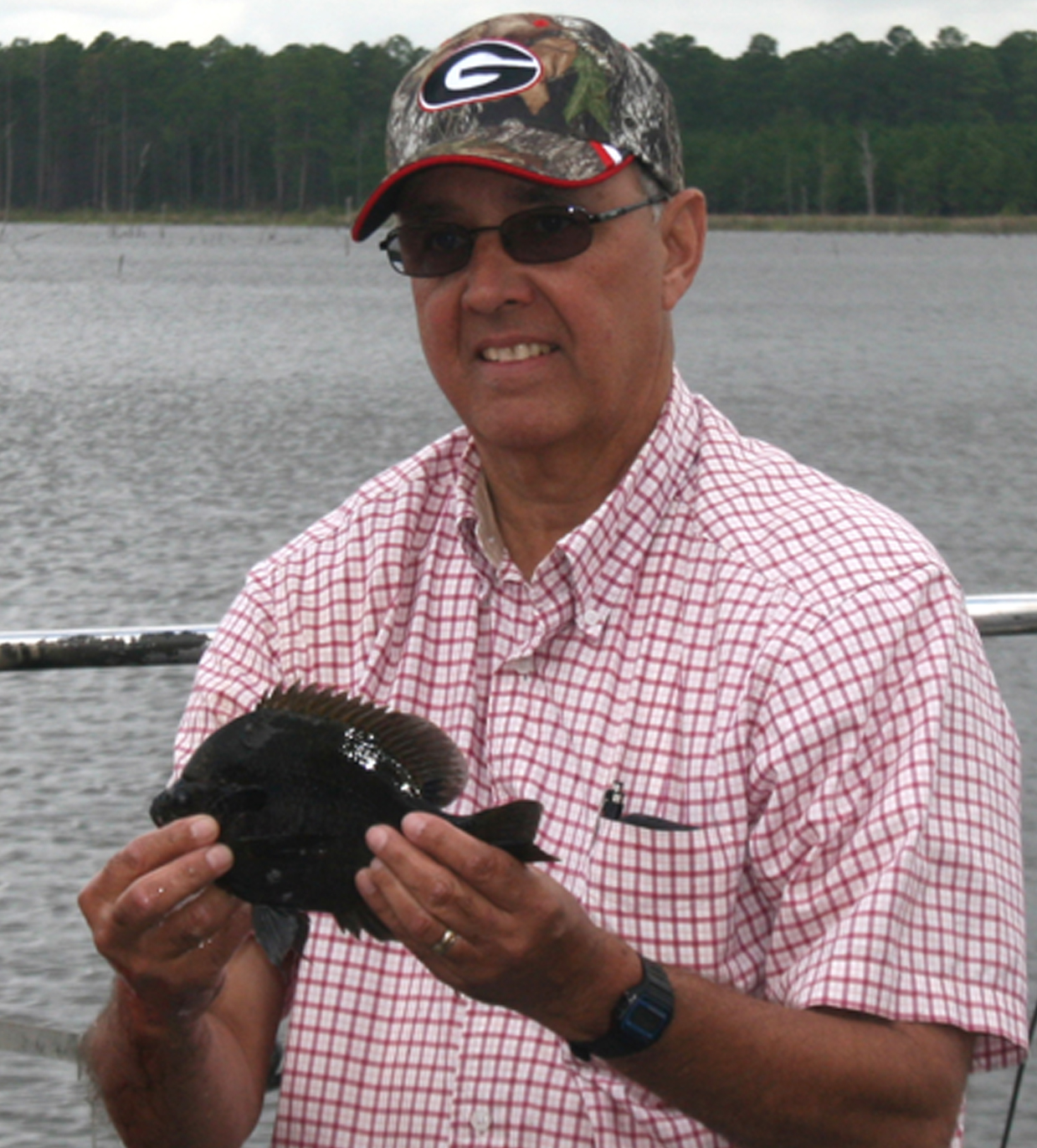 UGA Dooly County Extension agent Ronnie Barentine holds up a fish during a forestry/fisheries training for Extension agents, held in Tifton on Sept. 26, 2014.