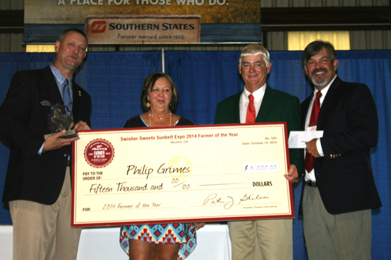 Pictured are, from left, Chip Blaylock, executive director of the Sunbelt Expo, Philip Grimes' wife Jane, Philip Grimes and Swisher Sweets representative Ron Carroll.