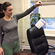 Kathryn Holland, a graduate student in the College of Family and Consumer Sciences, prepares to hang a radon testing kit in her office.
