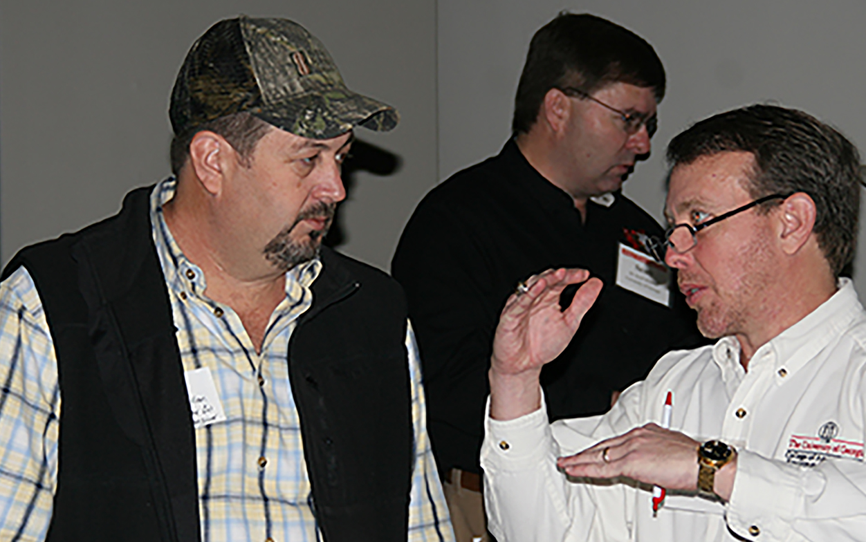 UGA economist Nathan Smith, right, talks with Washington County Extension agent Brent Allen during Thursday's Georgia Peanut Farm Show held at the UGA Tifton Campus Conference Center.