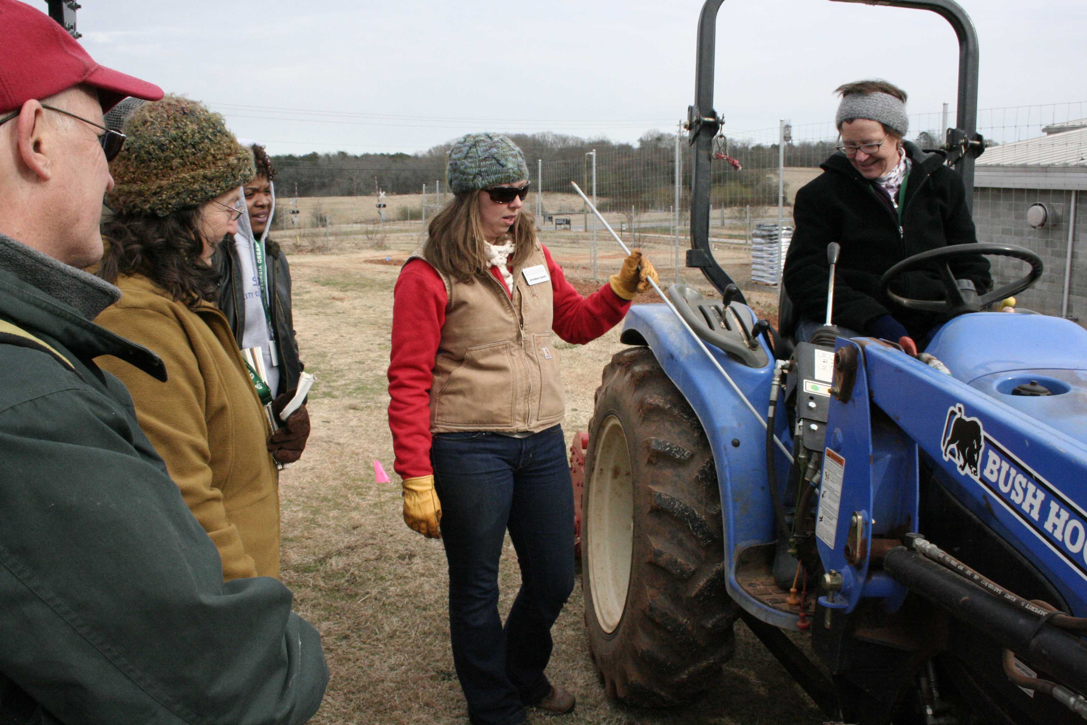 UGArden manager JoHannah Biang teaches Andy Myers, Lipscomb University student of sustainability and environmental agriculture, how to drive a small tractor as part of a workshop at the 2015 Georgia Organics Conference, Feb. 20-21, in Athens.