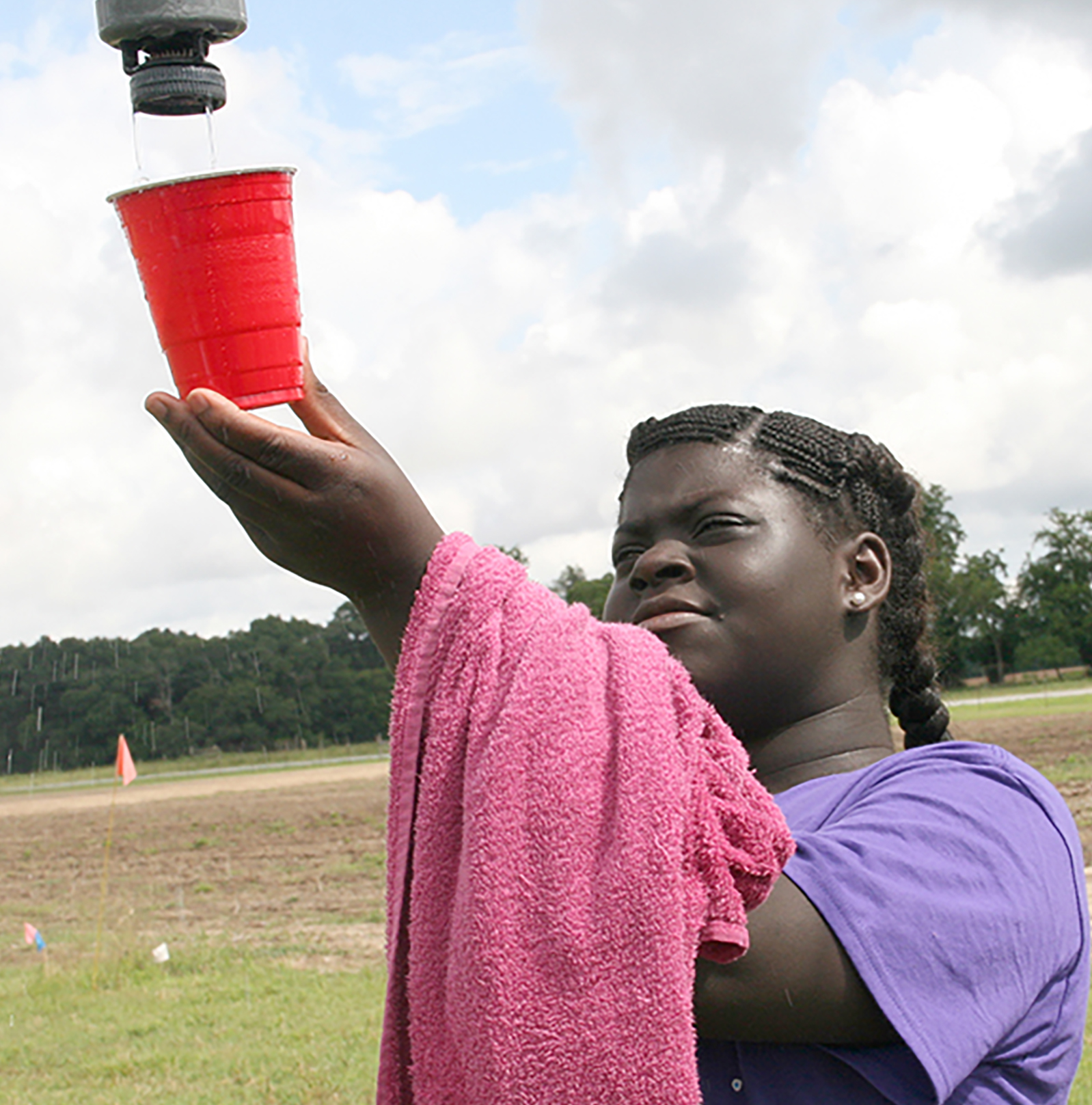 Endue Brown, a Sumter County 4-H'er, collects water from an irrigation pivot during a previous 4-H20 camp.