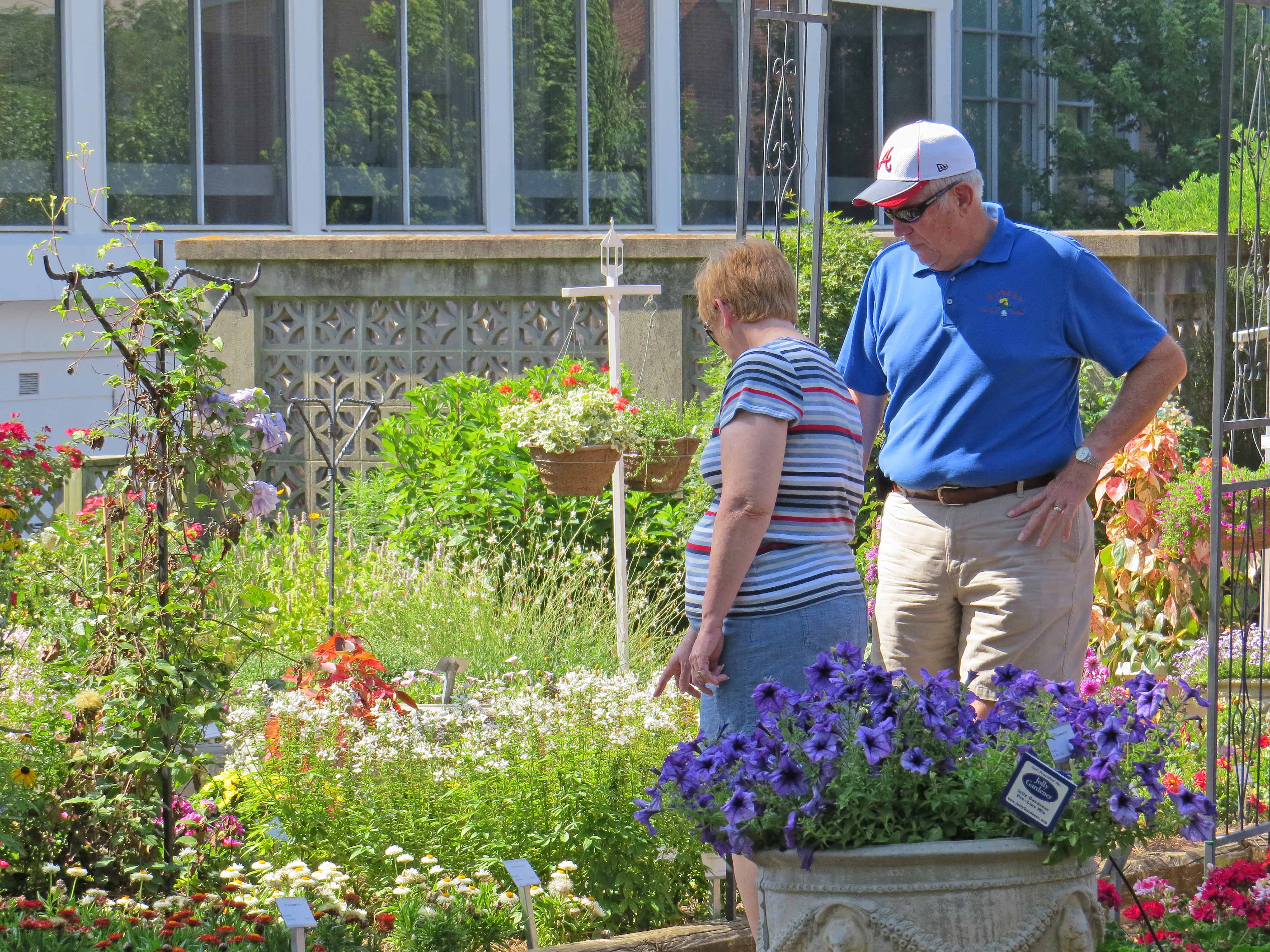 A couple browses this year's collection of annuals at The Trial Gardens at UGA during the industry open house in June. The gardens' staff will be hosting its annual Public Open House on July 18.