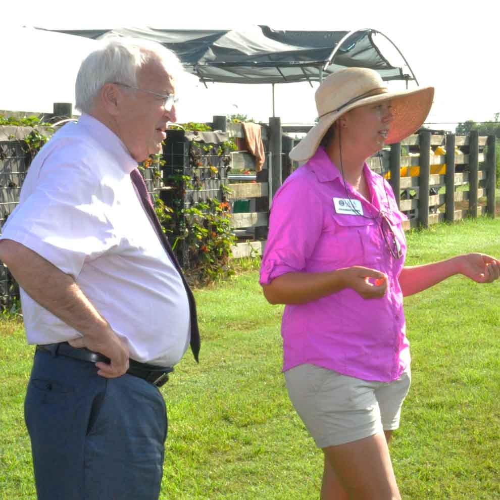 UGArden Manager JoHannah Biang gives a tour to USDA undersecretary Kevin Concannon during his tour of Athens on July 22, 2015.