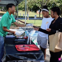 Christen Jackson, a USDA SNAP-Ed educator with UGA Extension in DeKalb County, prepares a healthy pasta dish as part of a nutrition demonstration at the DeKalb County Mobile Market.