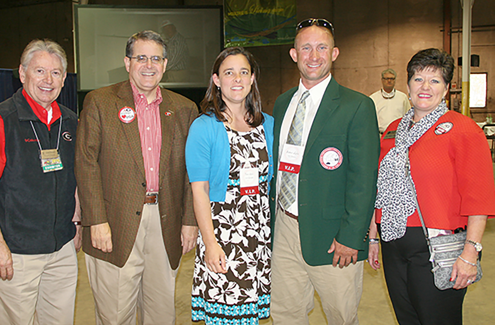 UGA President Jere Morehead poses for a picture with Georgia Farmer of the Year James Lyles and wife, Tara, during Tuesday's Farmer of the Year luncheon. Also pictured are Josef Broder, interim dean of the UGA CAES, and Laura Perry Johnson, associate dean for Extension.