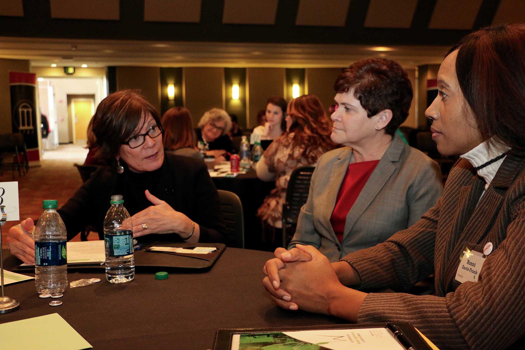 USDA Deputy Secretary Krysta Harden, center, and Georgia delegate Ronni Davis-Frank, right, listen to Maritza Soto Keen, a work session moderator from the UGA J.W. Fanning Institute for Leadership Development, at the Southern Region Women's Agricultural Leadership Summit on Feb. 8.