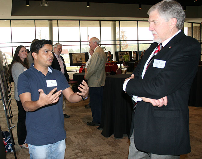 UGA graduate student Kiran Gadhave speaks about his research with Joe West, assistant dean on the UGA Tifton Campus on March 17, 2016.