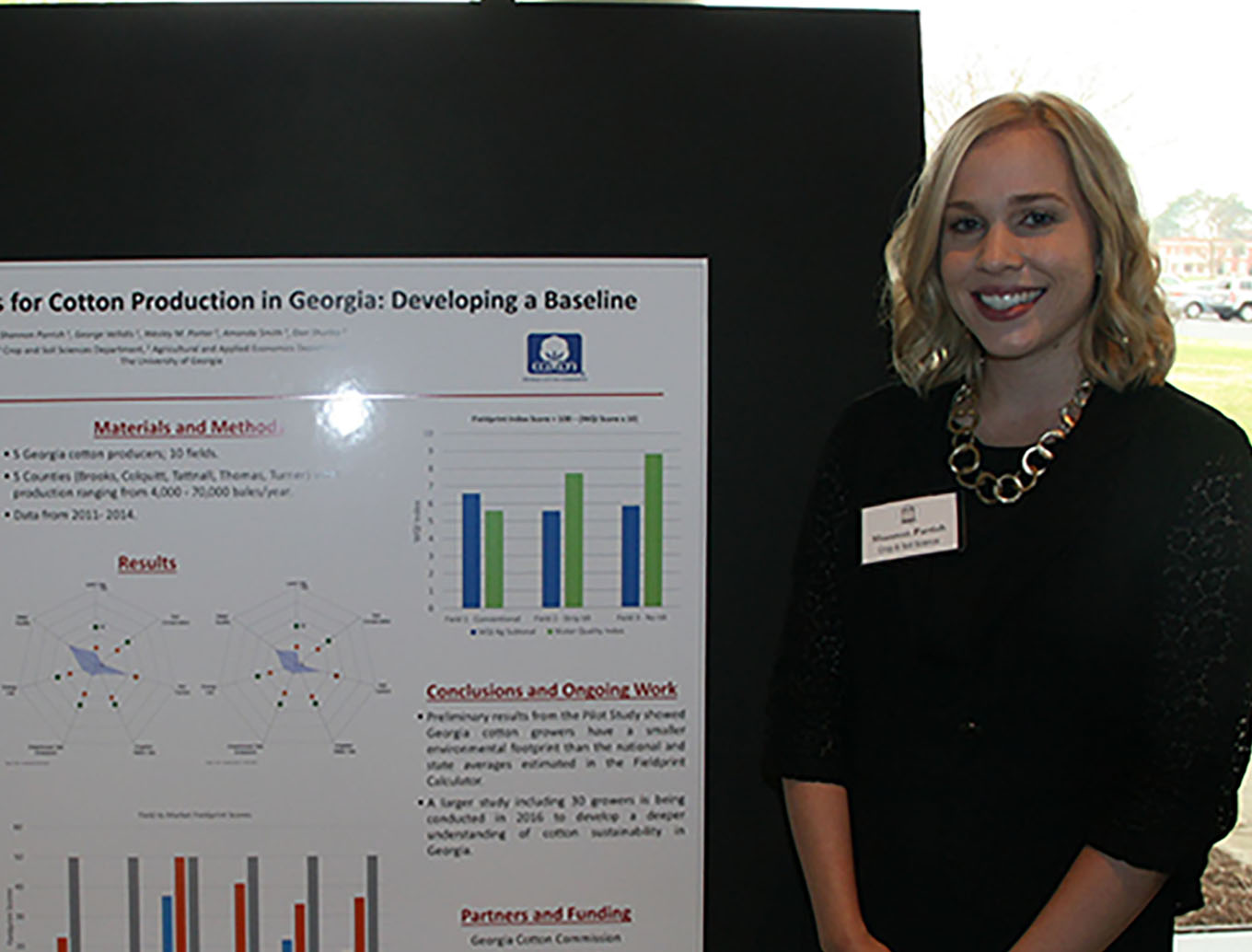 UGA graduate student Shannon Parrish stands next to her poster during the grad research event held at the UGA Tifton Campus Conference Center on March 17, 2016.