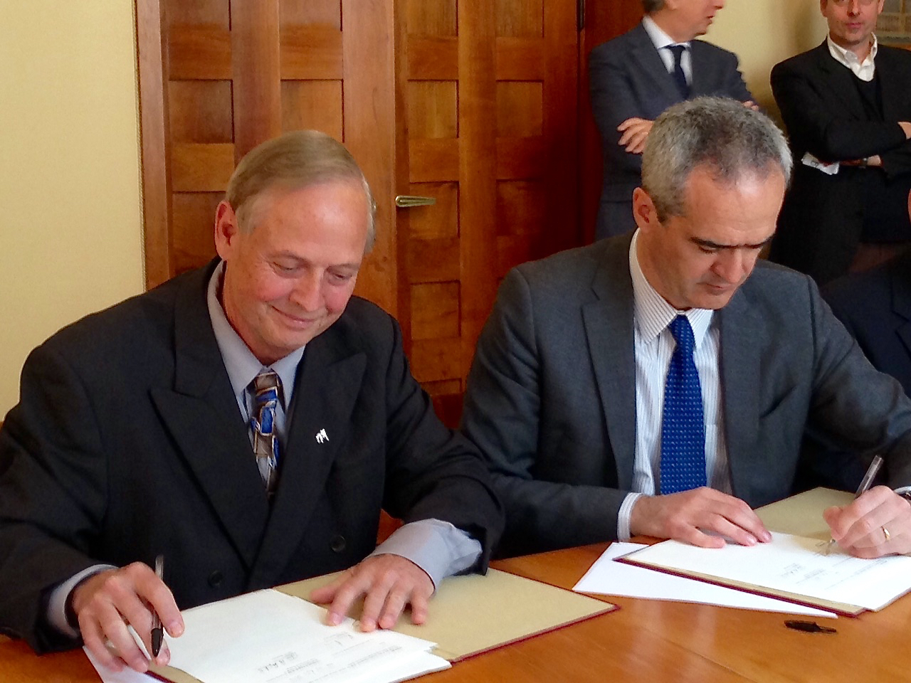 Don Shilling, left, head of the University of Georgia department of crop and soil sciences, and Rosario Rizzuto, rector of the University of Padova, sign an agreement finalizing a duel master's degree program between the universities.
