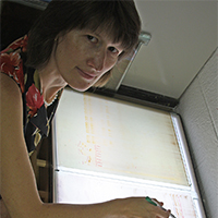 Professor Katrien Devos works as at a light table. Devos is a professor in the UGA Department of Crop and Soil Sciences and the Department of Plant Pathology, and she was recently named a fellow for the American Association for the Advancement of Science.