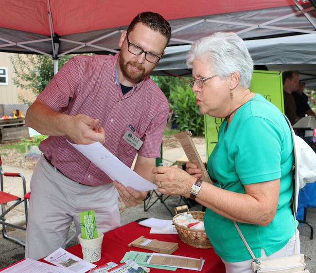 Jason Lessl, a program coordinator with the University of Georgia Agricultural and Environmental Services Laboratory, explains the benefit of soil testing to a client.