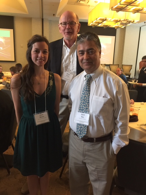 UGA alumnus Hiram Larew, back, celebrates with UGA food science graduate student Maria Moore and Director for Office of Global Programs Amrit Bart at the 2017 Association for International Agriculture and Rural Development Conference.