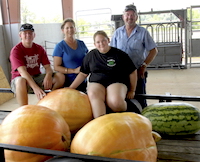 As Seminole County 4-H'ers, siblings Kelle and Sammy Alday both grew watermelons and pumpkins for the club's annual contests. The Alday family is known for being good melon growers. Kelle and Sammy are shown in this 2011 photo with their parents, Ricky and Gina Alday.