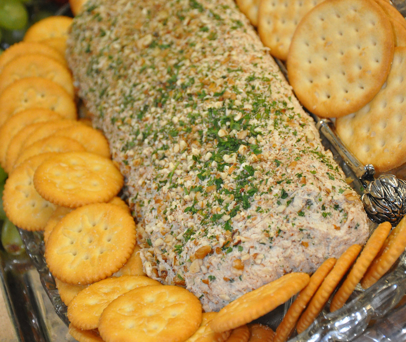 When planning a game day party, make healthy food choices by using white meat, such as the chicken in this chicken log, instead of beef and pork. To ensure that food remains at safe temperatures, keep cold-perishable foods in the refrigerator until right before the party and don't leave them at room temperature for more than two hours.