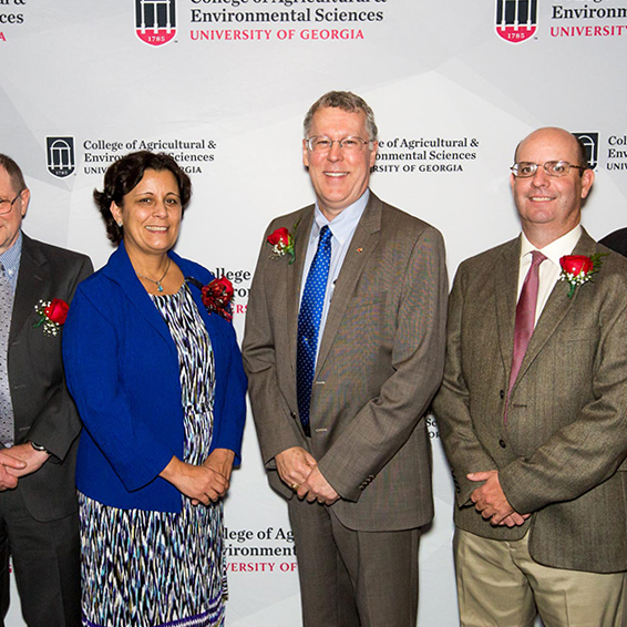 College of Agricultural and Environmental Sciences Dean and Director Sam Pardue (center) congratulates recipients of the CAES D.W. Brooks Awards Nov. 7. This year's winners include, from left, Professor Katrien Devos, Professor Ignacy Misztal, Professor Maria Navarro, UGA Extension Agriculture and Natural Resources Program Coordinator Wade Parker and Calvin Perry, superintendent of UGA's C.M. Stripling Irrigation Research Park.