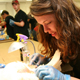 East Jackson High School student Brooke Chrisley carefully sutures her chicken.