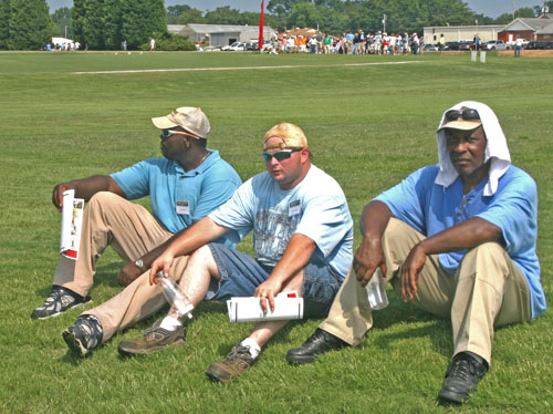 Three participants in the 2010 UGA Turfgrass Field Day take a break from the heat to hydrate and cool off.