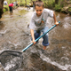 Alpharetta Elementary 4th graders from left Joey Santoro, 10, and Neal Seaman, 10, search a stream for life during environmental education at Washega 4H camp in Dahlonega, Thursday, April 28, 2005.