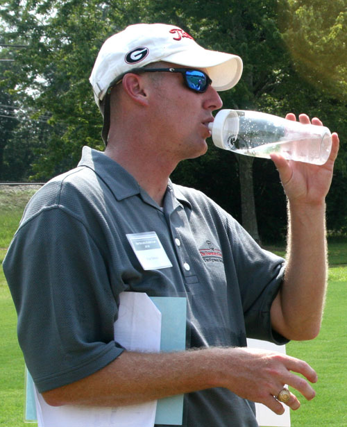 University of Georgia turfgrass specialist Brian Schwartz drinks water to stay hydrated during the 2010 UGA Turfgrass Field Day held in Griffin, Ga.