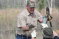 Mike Taylor with Stay Tuff Fence works on a fence during the Fencing Field Day at the Blackshank Farm on the UGA Tifton campus.
