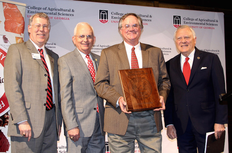 James Vaughn was named the 2018 Georgia Farmer of the Year during a ceremony held at the Georgia Freight Depot in Atlanta on Tuesday, March 20.  Pictured left to right are University of Georgia College of Agricultural and Environmental Sciences Dean Sam Pardue, Georgia Commissioner of Agriculture Gary Black, Vaughn and Georgia Governor Nathan Deal.