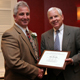 Eric Prostko, left, receives the D.W. Brooks Award for Excellence in Extension from J. Scott Angle, dean and director for the University of Georgia College of Agricultural and Environmental Sciences, at the annual luncheon in Athens, Ga. Prostko is a UGA Cooperative Extension weed specialist.