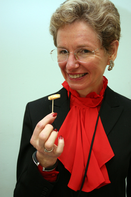 Caroline Harless poses with her Flat Creek Lodge Aztec Cheddar at the third Flavor of Georgia food product contest. The cheddar won grand prize at the competition.