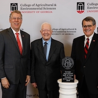 University of Georgia College of Agricultural and Environmental Sciences Dean Sam Pardue and University of Georgia President Jere Morehead congratulate former President of the United States Jimmy Carter before his induction into the Georgia Agricultural Hall of Fame November 9 at UGA.