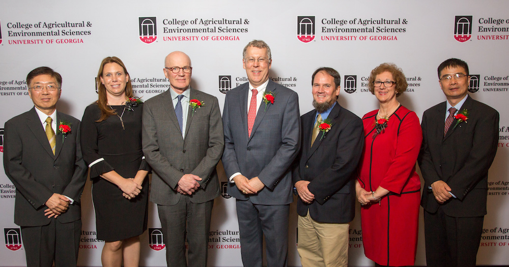 Agricultural policy expert Robert Paarlberg, center left, and Dean Sam Pardue of the UGA College of Agricultural and Environmental Sciences, center, congratulate the winners of the 2018 D.W. Brooks Faculty Awards for Excellence including, from left, Professor Yen-Con Hung, Associate Professor Kari Turner, Professor Dan Suiter, Senior Public Service Associate Lisa Jordan, and Professor Qingguo “Jack” Huang.