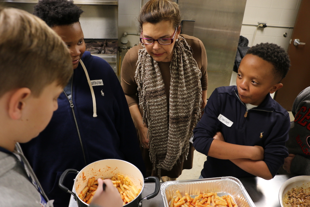 Georgia 4-H Club members Beau Gabriel, from left, Vatavion Faust and Davison Willis make ziti as part of Oglethorpe County 4-H Club's Cooking to Share program with adult volunteer Jane Eason.