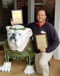 Greg Huber, the training coordinator for the University of Georgia Center for Urban Agriculture, received GGIA’s Communicator of the Year Award. The award honors the individual who best served the horticulture industry in Georgia through the media and other forms of promotion. He is shown with the center's personal UGA mascot, Agga. Huber designed the mascot which wears a green sweater and is adorned with plant life typically found in urban landscapes. Huber also designed the UGA Griffin Campus’ original Uga mascot which is located on the campus quad where it welcomes visitors to the campus.