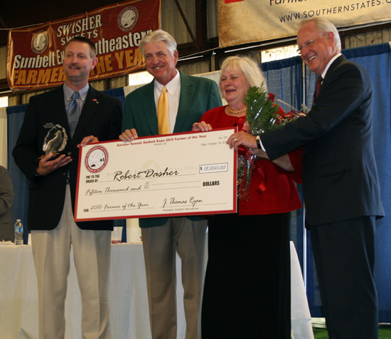Georgia Vidalia Onion grower Robert Dasher (center) won the 21st annual Swisher Sweets/Sunbelt Expo Southeastern Farmer of the Year award, announced each year at the Sunbelt Expo. Each year, 10 southeastern states each send a farmer to compete for the title.