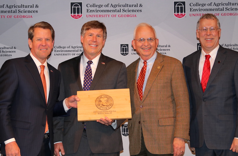 Georgia Gov. Brian Kemp presented the 2019 Georgia Farmer of the Year award to Crawford County farmer Robert Dickey during a reception held Tuesday, March 19, at the Georgia Freight Depot in Atlanta. Pictured left to right are Kemp, Dickey, Georgia Commissioner of Agriculture Gary Black and UGA College of Agricultural and Environmental Sciences Dean Sam Pardue.