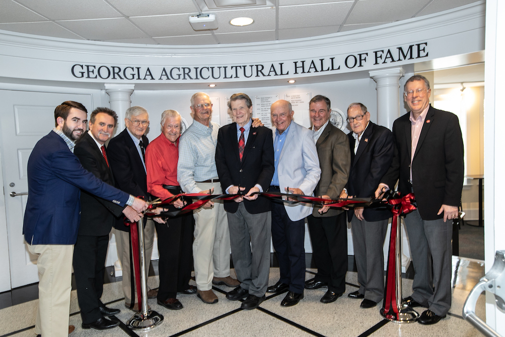 From left, Rep. Houston Gaines (Georgia House District 117), CAES Alumni Association President Van McCall and Georgia Agricultural Hall of Fame inductees Robert Lowery, Louie Boyd, Fred Greer, Abit Massey, Johnny Crawford, Wayne Hanna and Buddy Leger celebrate the dedication of the renovated hall of fame with CAES Dean and Director Sam Pardue.