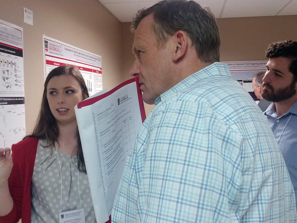 Forty-six people presented posters at the RBC Symposium held Friday, April 26. RBC Symposium Judge Simon Platt, BVM&S, a UGA professor of veterinary neurology, is shown with RBC poster presenter Katherine Watkins of the Easley Lab. View more images at https://adobe.ly/2vBPsxf.