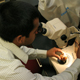 Lucky Mehra examines a pomegranate infected with Cercospora fruit spot at a lab in Athens, Ga.