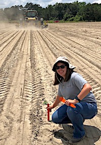 University of Georgia Cooperative Extension intern Lauren Dubberly is spending her summer working with Cook County Agent Tucker Price. She's shown marking a research trial in a peanut field. Dubberly says she is learning a lot about diseases found in fruit, vegetable and row crops.