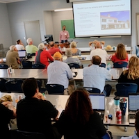 University of Georgia Cooperative Extension viticulture specialist goes over the basics of starting a muscadine vineyard at a muscadine workshop in Athens on July 9, 2019.